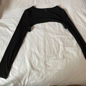 I'm selling a open high crop top with long sleeves. Thin fabric.